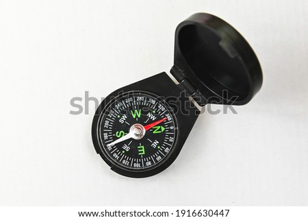 Compass. Magnetic compass on a white background.