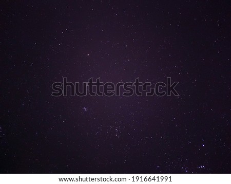 Night shining starry sky, blue space background with star, cosmos, trees.