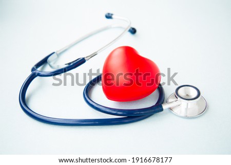 Red heart with and stethoscope on blue background. Medical and Health care, Valentines day. Royalty-Free Stock Photo #1916678177