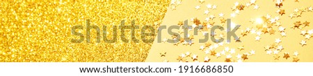 Gold stars background. Yellow glitter backdrop. Golden texture. New year luxury snow. Copyspace, banner. Shimmer confetti wallpaper. Dreamy shiny design detail