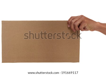 Hand holding up a cardboard sign