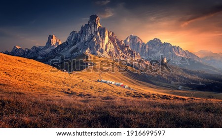 Scenic image of mountains during sunset. Amazing nature scenery of Dolomites Alps. Passo Giau popular travel destination in Dolomites. travel, adventure, concept image. Stunning natural background. Royalty-Free Stock Photo #1916699597