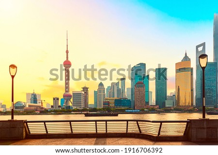 Cityscape of Shanghai at sunrise. Panoramic view of Pudong business district skyline from the Bund