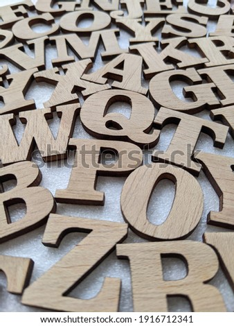 3d alphabet initials with the letter Q in the middle