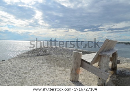 "An Ocean View And A Wooden Chair"

This is a nice and calming photo with a view of the Atlantic Ocean in summer.