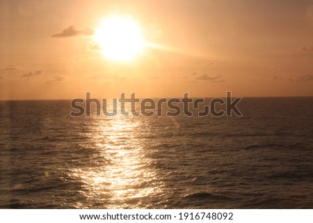 Sunrise and reflection on sea