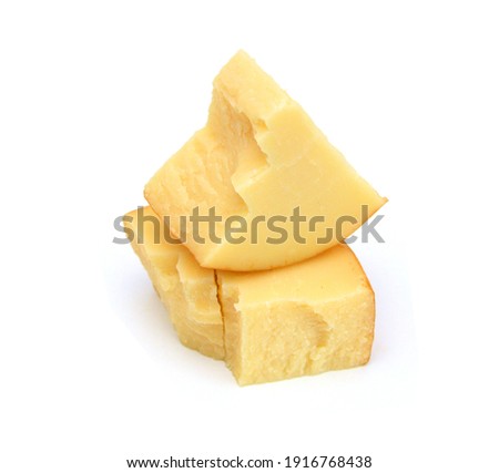 Cubes of cheddar cheese isolated on white  Royalty-Free Stock Photo #1916768438