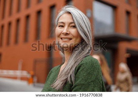 Potrait of matured asian woman in city
