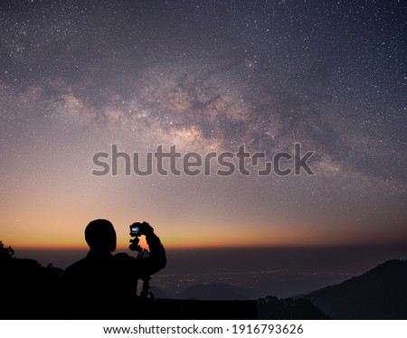 The stars and the milky way in the dark night sky are very beautiful. Royalty-Free Stock Photo #1916793626