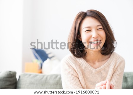 young attractive asian woman relaxing Royalty-Free Stock Photo #1916800091