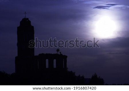 Old church ruins in the night under the moonlight.