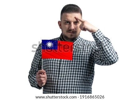 White guy holding a flag of Republic of China and a finger touches the temple on the head isolated on a white background.