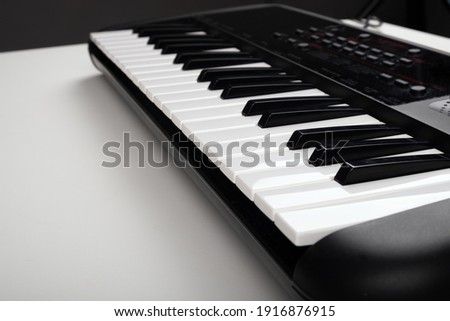 synthesizer on a white table,musical instrument closeup.