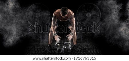 Sporty man workout with kettlebell. Sports banner. Horizontal copy space background