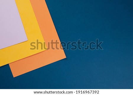 sheets of colored paper for creativity on the table