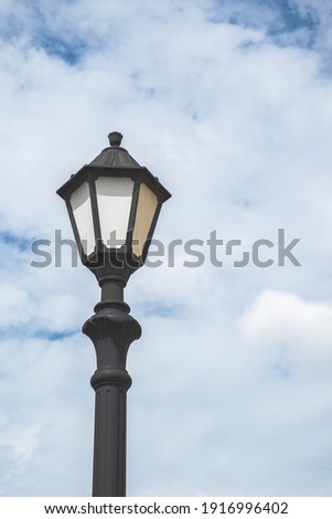 A floating lamppost and a cloudy background