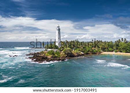 Lighthouse and beautiful beach landscape in Sri Lanka Royalty-Free Stock Photo #1917003491