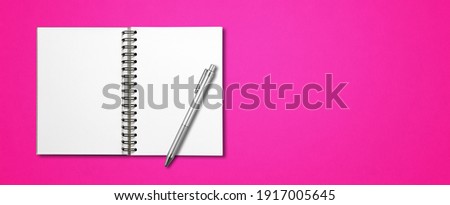 Blank open spiral notebook mockup and pen isolated on pink horizontal banner