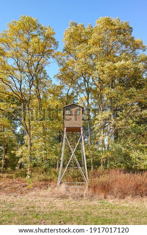 Picture of a wooden hunting tower in autumn.