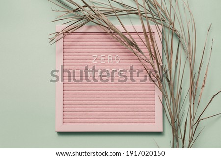 Zero waste white text on on a recycled paper background. Eco waste recycling concept