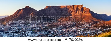 Winter sunrise over Table Mountain and Devil's Peak Royalty-Free Stock Photo #1917020396