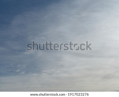 Cirrostratus also known as veil clouds in winter with a slight spotlight Royalty-Free Stock Photo #1917023276