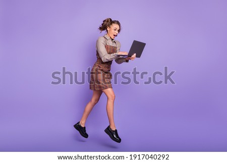 Full body profile portrait of astonished person browsing open mouth running isolated on violet color background