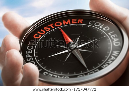 Hand holding a compass with needle pointing the word customer. Acquisition concept. Composite image between a hand photography and a 3D background.