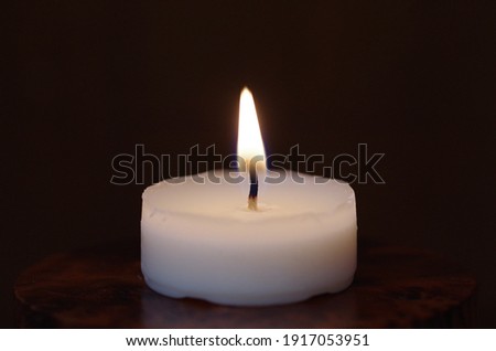 Tealight candle set on fire