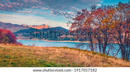 Landscape photography. Panoramic autumn view of Roselend lake (Lac de Roselend). Majestic morning scene of Auvergne-Rhone-Alpes, France, Europe. Beauty of nature concept background.