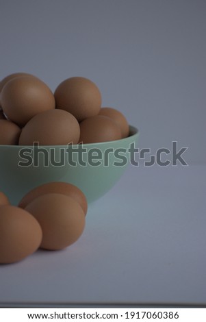 An image of eggs in the white bowl on the white background