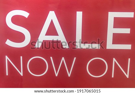 Sale now on red with white letters