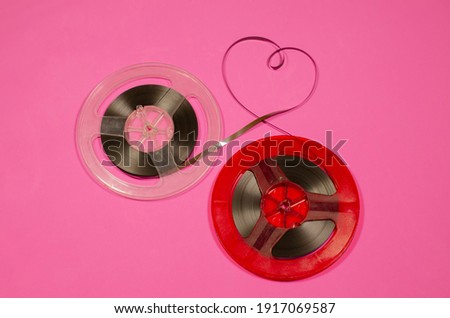 Vintage Reel to Reel Tape  on pink background