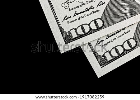 topview of fragment of dollar bills on black velvet, as a background 