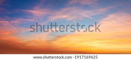 Real amazing panoramic sunrise or sunset sky with gentle colorful clouds. Long panorama, crop it Royalty-Free Stock Photo #1917169625