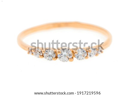 Gold ring on white background close-up