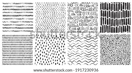 Hand drawn ink pattern and textures set. Expressive seamless abstract vector backgrounds in black and white. Trendy monochrome brush marks. Royalty-Free Stock Photo #1917230936