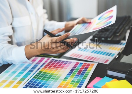 Graphic design using graphics tablet 
drawing creative logo design brand designer sketch with Color swatch samples