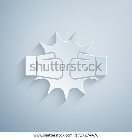 Paper cut Punch in boxing gloves icon isolated on grey background. Boxing gloves hitting together with explosive. Paper art style. Vector.