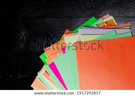 Abstract Paper geometric black, red, yellow, green background texture