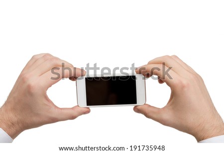 business, internet and technology concept - close up of man hands holding smartphone