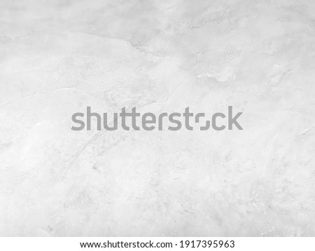 Soft abstract white grunge cement or concrete wall texture background. White cement wall texture for interior design for the background. The black and white concept of a plain white plastered brick.