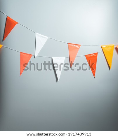 Party flags for decoration and covering on grey background