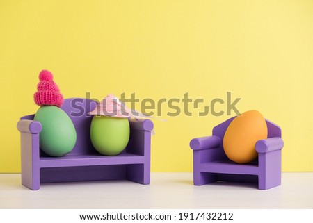 Couple at a psychologist. Easter holiday concept with cute eggs with funny faces. Different emotions and feelings. Mental health in the family