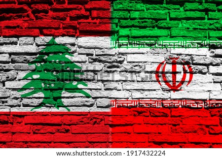 Flag of Lebanon and Iran on brick wall