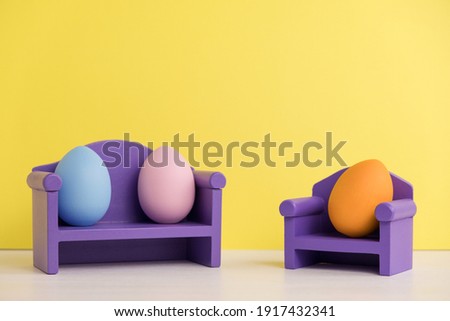 Couple at a psychologist. Easter holiday concept with cute eggs with funny faces. Different emotions and feelings. Mental health in the family