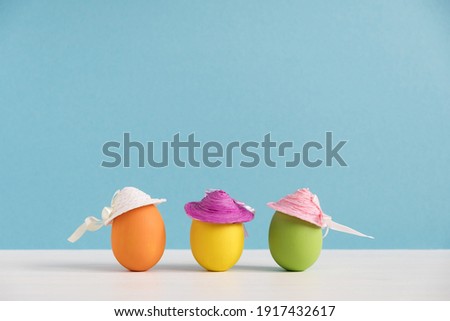 Positive girlfriends. Happy eggs in hats. Easter holiday concept with cute funny eggs. Different emotions and feelings
