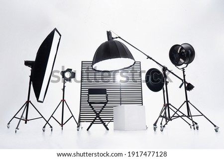 Modern photo studio with professional equipment. White cyclorama.
