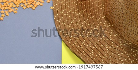 Brown hat on a gray-yellow background. stars on a gray background.