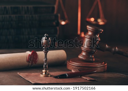 Vintage stamp, last will and judge gavel on a wooden desk